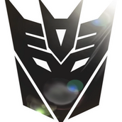 A black image of the Decepticon faction symbol with some serious lens flare